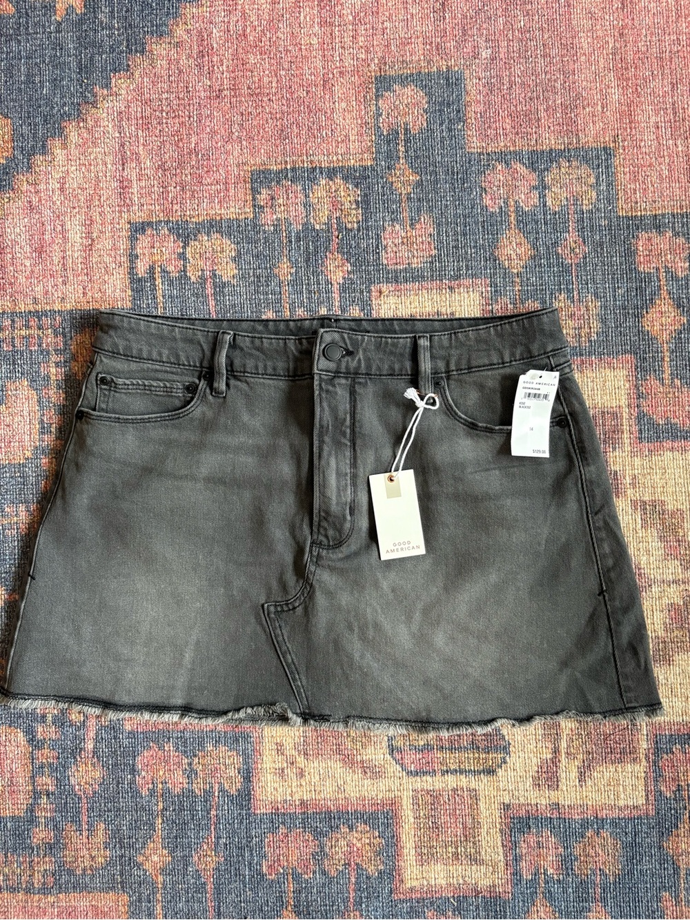 Good American Washed Black Denim Mini Skirt with Raw Hem